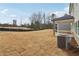 Large backyard with covered patio and AC unit at 3913 Brushy St, Powder Springs, GA 30127
