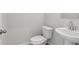 Clean and modern bathroom with white sink and toilet at 3913 Brushy St, Powder Springs, GA 30127