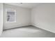 Simple bedroom featuring grey carpet and a window at 3913 Brushy St, Powder Springs, GA 30127