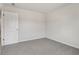 Bright bedroom featuring grey carpet and an adjacent bathroom at 3913 Brushy St, Powder Springs, GA 30127