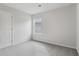 Well-lit bedroom with grey carpet and a window at 3913 Brushy St, Powder Springs, GA 30127