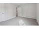 Well-lit bedroom with grey carpet and access to a hallway at 3913 Brushy St, Powder Springs, GA 30127
