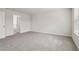 Bright bedroom with grey carpet and an ensuite bathroom at 3913 Brushy St, Powder Springs, GA 30127