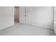 Bright bedroom with grey carpet and double doors at 3913 Brushy St, Powder Springs, GA 30127