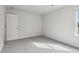 Neutral-toned bedroom with grey carpet and a door at 3913 Brushy St, Powder Springs, GA 30127