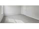 Spacious bedroom featuring grey carpet and a window offering natural light at 3913 Brushy St, Powder Springs, GA 30127