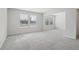 Spacious bedroom with grey carpet and two large windows at 3913 Brushy St, Powder Springs, GA 30127