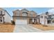 Two-story house with stone accents and a large front yard at 3913 Brushy St, Powder Springs, GA 30127