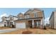 Two-story house with stone accents and a large front yard at 3913 Brushy St, Powder Springs, GA 30127