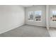 Bright living room with grey carpet and natural light at 3913 Brushy St, Powder Springs, GA 30127