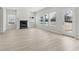 Spacious living room with fireplace and wood-look floors at 3913 Brushy St, Powder Springs, GA 30127