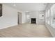 Bright living room with fireplace and wood-look floors at 3913 Brushy St, Powder Springs, GA 30127