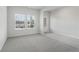 Bright and airy living room with large windows and grey carpet at 3913 Brushy St, Powder Springs, GA 30127