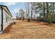 Large backyard with new sod and a partially sloped terrain at 3933 Brushy St, Powder Springs, GA 30127