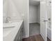 Double vanity bathroom with grey cabinets and a view of bedroom at 3933 Brushy St, Powder Springs, GA 30127