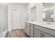 Modern bathroom with double vanity and grey cabinets at 3933 Brushy St, Powder Springs, GA 30127