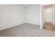 Spacious bedroom with carpet flooring and access to hallway at 3933 Brushy St, Powder Springs, GA 30127