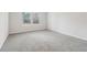 Spacious bedroom with grey carpet and two large windows at 3933 Brushy St, Powder Springs, GA 30127