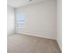 Simple bedroom with carpeted floor and a window with blinds at 3933 Brushy St, Powder Springs, GA 30127