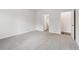 Bright bedroom with carpet, and views of bathroom and hallway at 3933 Brushy St, Powder Springs, GA 30127