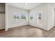 Breakfast nook with view of backyard and neutral decor, hardwood floors at 3933 Brushy St, Powder Springs, GA 30127