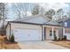 Two-story craftsman home with gray siding and a white brick base at 3933 Brushy St, Powder Springs, GA 30127