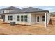 Rear view of a new house featuring a covered patio at 3933 Brushy St, Powder Springs, GA 30127