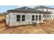 Rear view of house showcasing the back patio and landscaping at 3933 Brushy St, Powder Springs, GA 30127