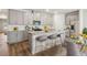 Modern kitchen with island, breakfast bar, and gray cabinets at 3933 Brushy St, Powder Springs, GA 30127