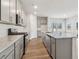 Modern kitchen with gray cabinets, granite counters, and stainless steel appliances at 3933 Brushy St, Powder Springs, GA 30127