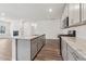 Modern kitchen with gray cabinets, granite countertops and island at 3933 Brushy St, Powder Springs, GA 30127