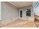 Covered patio with brick base and access door at 3933 Brushy St, Powder Springs, GA 30127
