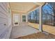 Covered outdoor patio featuring brick base and a white support column at 4835 Marjorie Dr, Cumming, GA 30041