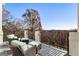 Relaxing outdoor balcony seating area with scenic views of wooded area and room for relaxation at 8380 Sentinae Chase Dr, Roswell, GA 30076