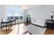 Versatile bonus room with hardwood floors, large window, and natural light at 8380 Sentinae Chase Dr, Roswell, GA 30076