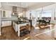 Modern kitchen featuring granite countertops, an island with seating, and stainless steel appliances at 8380 Sentinae Chase Dr, Roswell, GA 30076