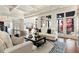 Bright and airy living room with French doors, hardwood floors, and stylish decor at 8380 Sentinae Chase Dr, Roswell, GA 30076