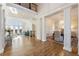 Spacious and open floor plan with hardwood floors, grand windows, and access to dining and living areas at 8380 Sentinae Chase Dr, Roswell, GA 30076