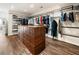Spacious walk-in closet with custom shelving and a large center island for storage at 8380 Sentinae Chase Dr, Roswell, GA 30076