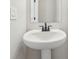 Modern bathroom with pedestal sink and updated faucet at 4755 Marjorie Dr, Cumming, GA 30041