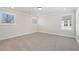 Simple bedroom with grey carpet and multiple windows at 4755 Marjorie Dr, Cumming, GA 30041