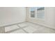 Spacious bedroom with neutral carpeting and large windows at 4755 Marjorie Dr, Cumming, GA 30041