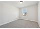 Spacious bedroom with grey carpet and a window at 4755 Marjorie Dr, Cumming, GA 30041