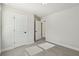 Bedroom with neutral carpeting, door to hallway and window at 4755 Marjorie Dr, Cumming, GA 30041