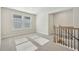 Spacious bonus room with neutral carpeting and staircase at 4755 Marjorie Dr, Cumming, GA 30041