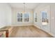 Bright dining room featuring hardwood floors and access to backyard at 4755 Marjorie Dr, Cumming, GA 30041