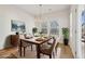 Virtually staged dining room, hardwood floors, and large windows at 4755 Marjorie Dr, Cumming, GA 30041