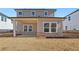 Two story house with covered patio and backyard at 4755 Marjorie Dr, Cumming, GA 30041
