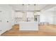 Modern kitchen with white cabinets, quartz countertops, and a large island at 4755 Marjorie Dr, Cumming, GA 30041