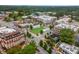 Aerial view of a charming town square with shops and a lush green space at 5065 Winship Ct, Alpharetta, GA 30009